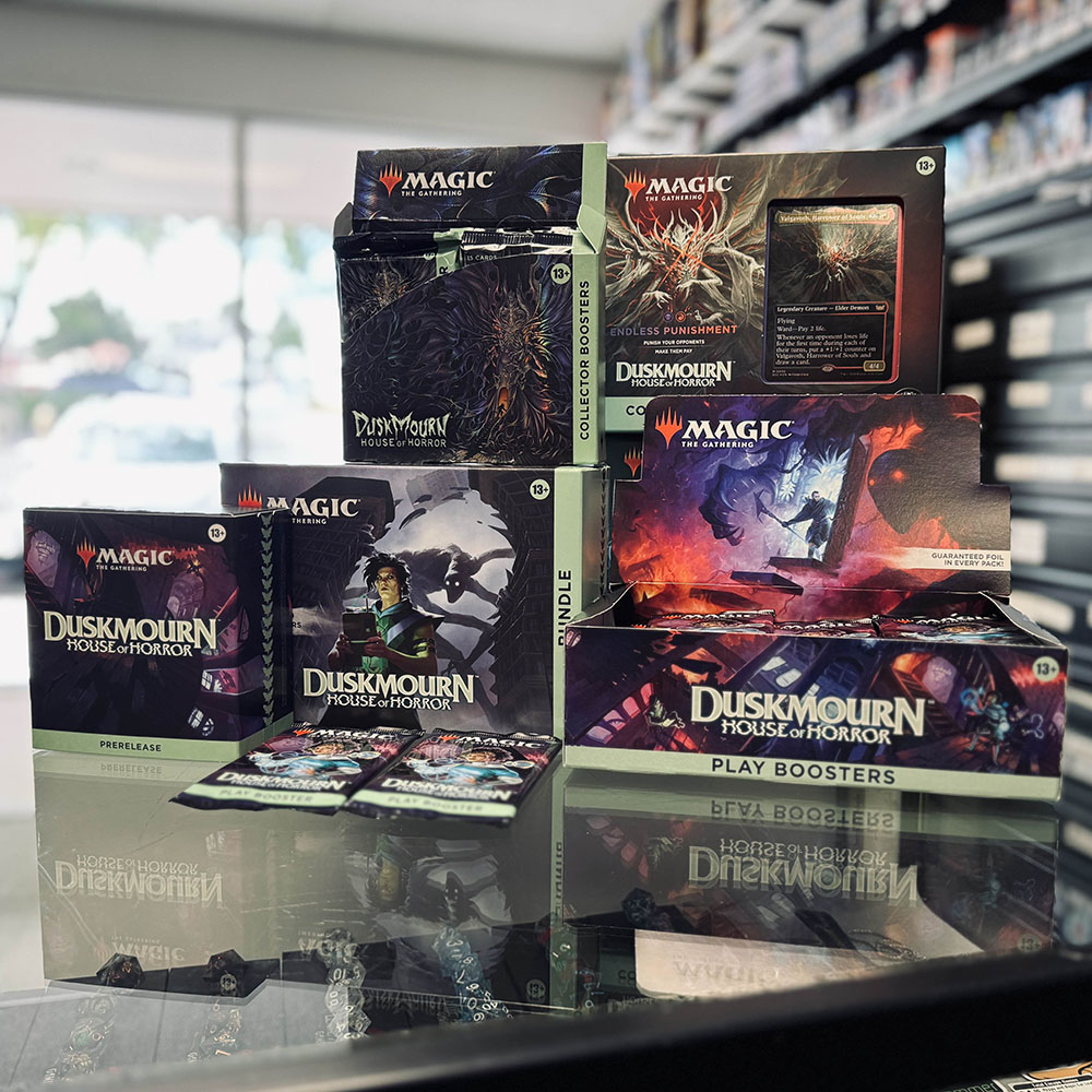 A pile of Magic the Gathering boxes on the store counter, ready for sale